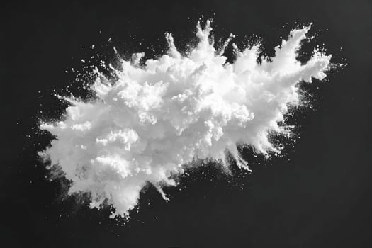 White Powder Explosion on Black Background photo