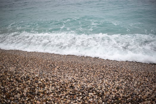 wave on the pebble shore. great background for your design photo