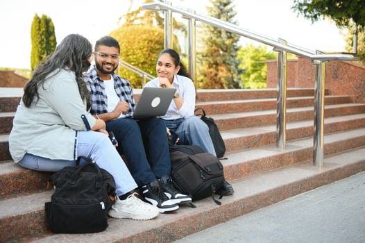 Group of smiling multiethnic near university campus photo
