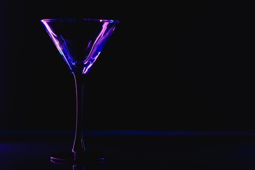silhouette of martini glass on black background photo