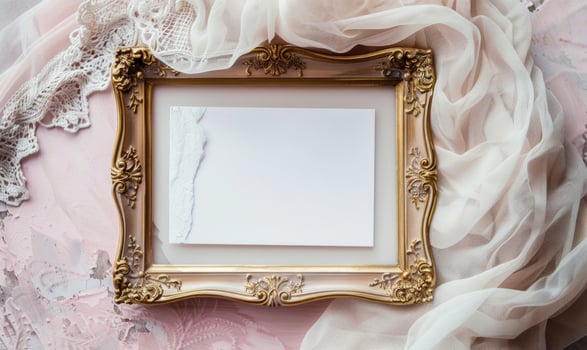 White blank card in an elegant gold frame on a pastel pink table, with a delicate lace cloth, soft lighting photo