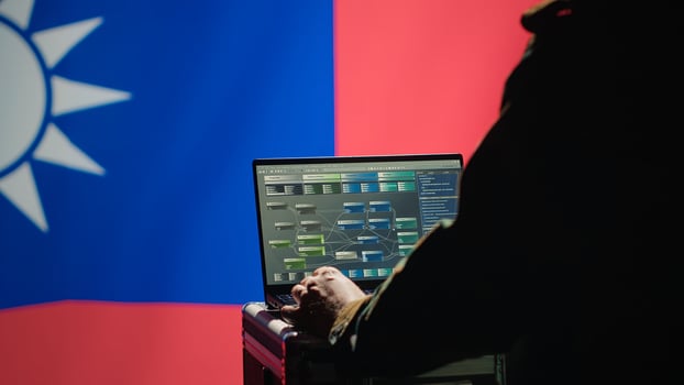 Military engineer creating fake accounts on social media to persuade other nations to act in Taiwanese government interests. Taiwan insurgent influences people online to support independence, camera A photo