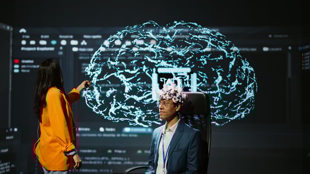 Company CEO using summit as platform to launch latest AI EEG headset product. Neuroscientist doing demonstration at forum in front of business leaders interested in artificial intelligence, camera B photo