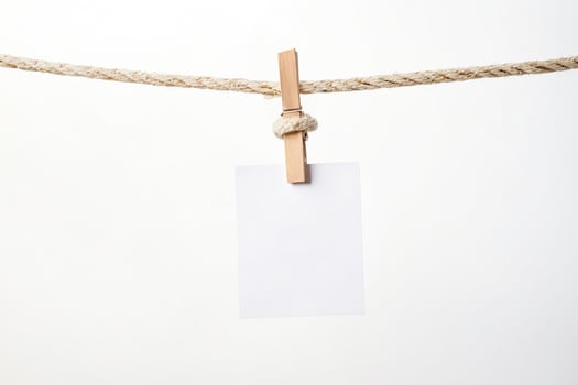 Blank White Card Hanging on Rope with Wooden Clip photo