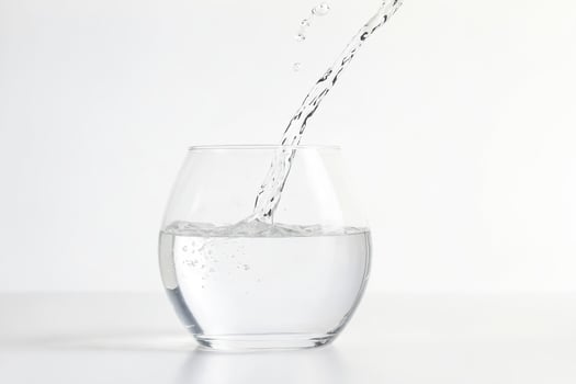 Water pouring into a glass photo