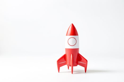 Red Rocket Ship on White Background photo