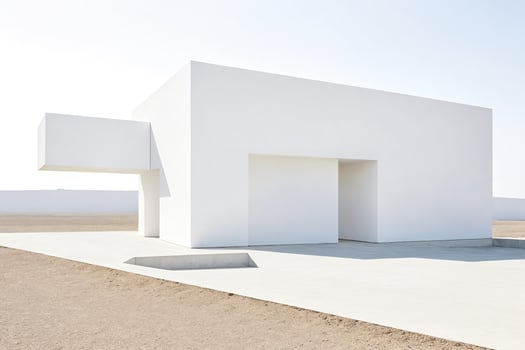 White Minimalist Building in Desert Landscape photo