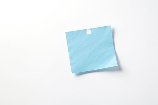Blue Sticky Note with Hole on White Background photo