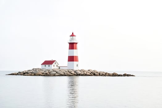 Lighthouse on a Rocky Outcrop photo