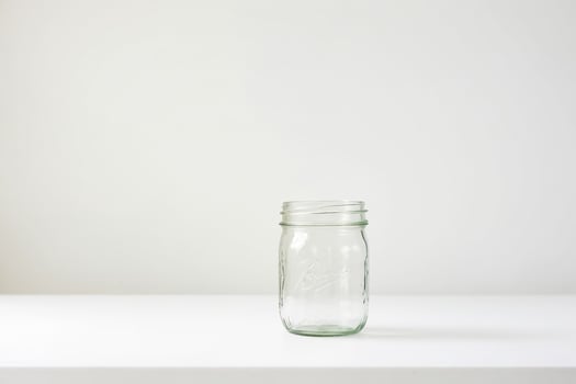 Empty Glass Jar on White Background photo