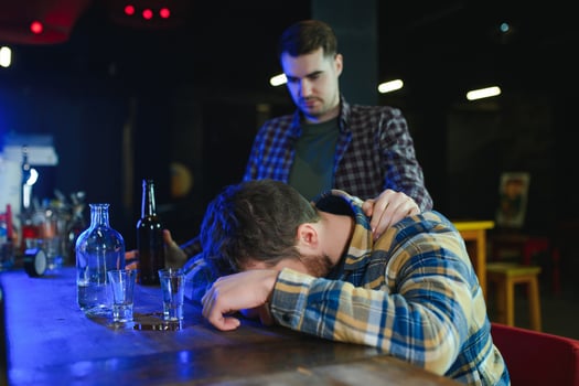 Young drunk man in bar photo