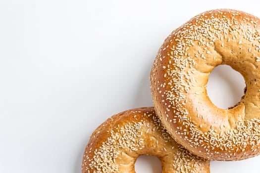 Freshly Baked Sesame Bagels on White Background photo