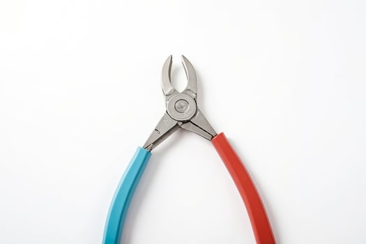 Red and Blue Pliers on White Background photo