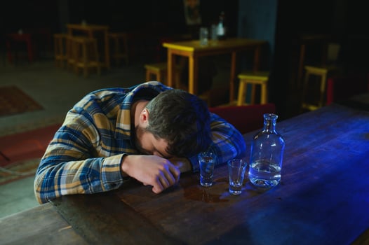 Young drunk man in bar photo