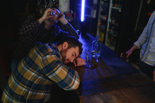 Sad man sitting at bar counter, alcohol addiction photo