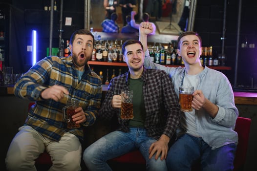 Sport, people, leisure, friendship, entertainment concept - happy male football fans or good yuong friends drinking beer, celebrating victory at bar or pub. Human positive emotions concept photo