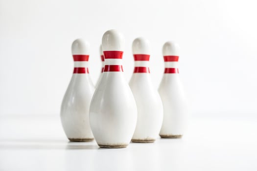 White Bowling Pins on a White Background photo