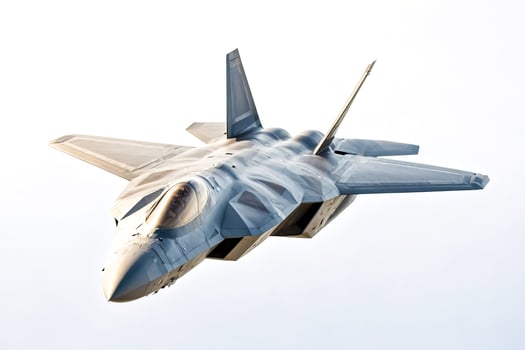 F-22 Raptor Fighter Jet Flying Against a White Sky photo