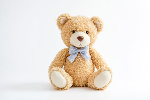 Cute teddy bear with bow tie isolated on white background photo
