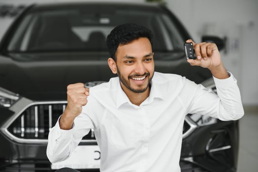 Closeup portrait happy, smiling, young man, buyer showing keys of his new car photo