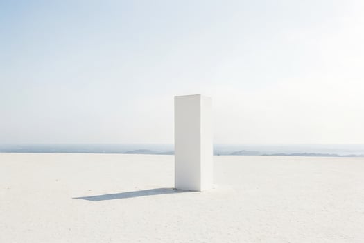 Minimalist White Column in a Desert Landscape photo