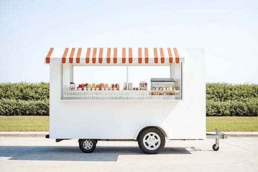 White Food Truck with Red and White Striped Awning photo