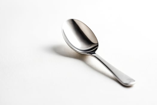 Silver Teaspoon on White Background photo