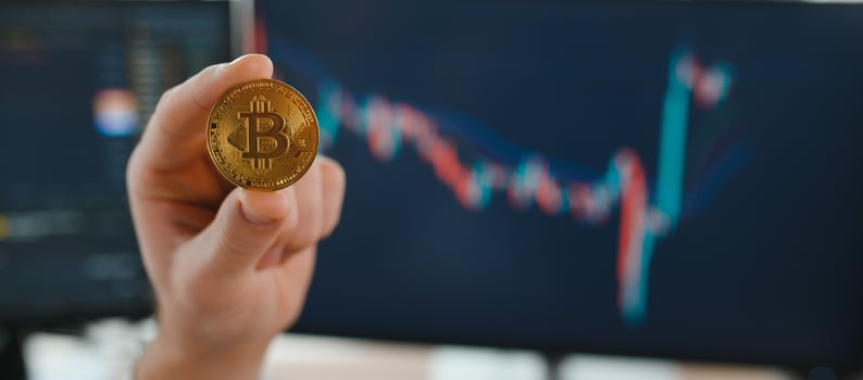 Business man crypto trader investor analyst holding gold bitcoin coin buying cryptocurrency tokens analyzing stock market data investment risks. photo