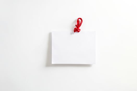 Blank White Paper With Red String photo