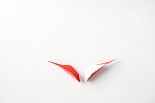 Red and White Paper Shapes on White Background photo
