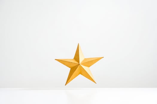 Golden Star on White Background photo