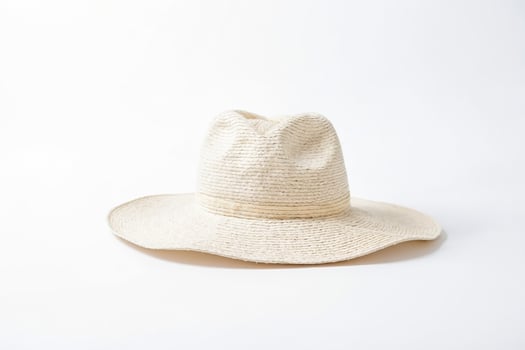 Close-up of a White Straw Hat on a White Background photo