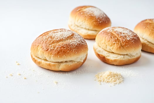 Coconut-Crusted Bread Rolls on a White Surface photo