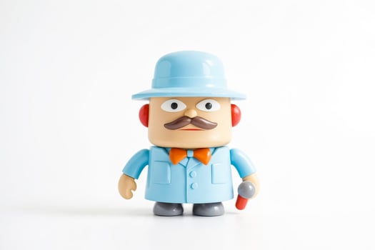 Toy Figure of a Man in a Blue Suit Holding a Microphone photo