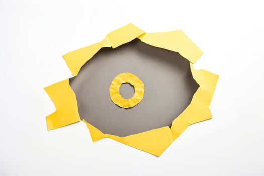Yellow Torn Paper on Gray Background photo