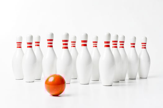 Bowling pins and ball on a white background photo