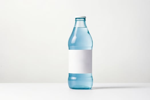 Glass bottle with white label mockup photo