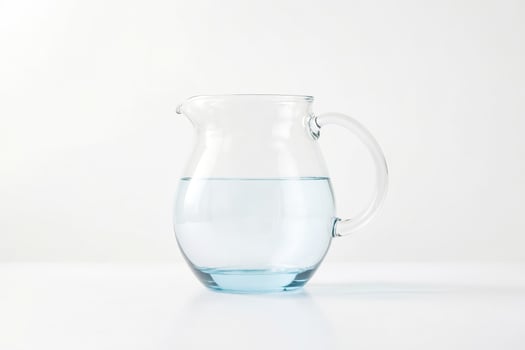 Glass Pitcher with Water on White Background photo