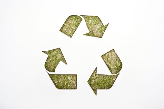 Recycling symbol made of crushed glass photo