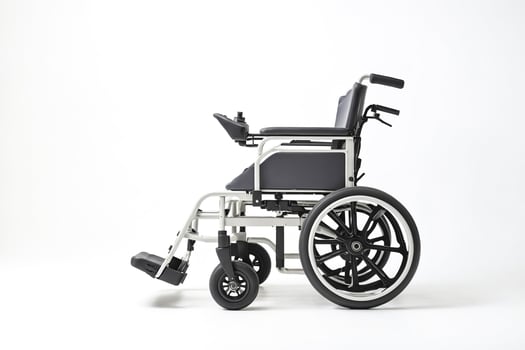 Modern electric wheelchair isolated on white background photo