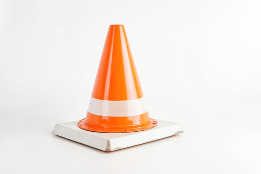 Orange Traffic Cone on White Background photo