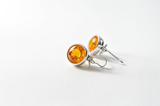 Closeup of Amber Earrings on White Background photo