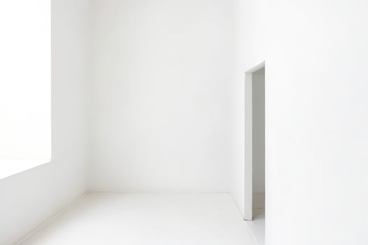 Minimalist White Room with Open Doorway photo