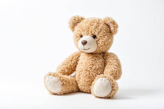 Brown Teddy Bear Sitting on White Background photo