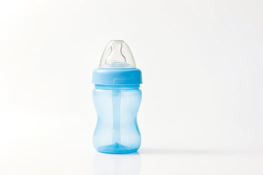 Blue baby bottle with straw photo