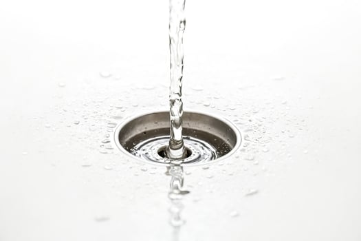 Water Dropping into a Drain photo