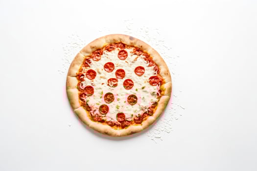 Pepperoni pizza with melted mozzarella cheese on a white background photo