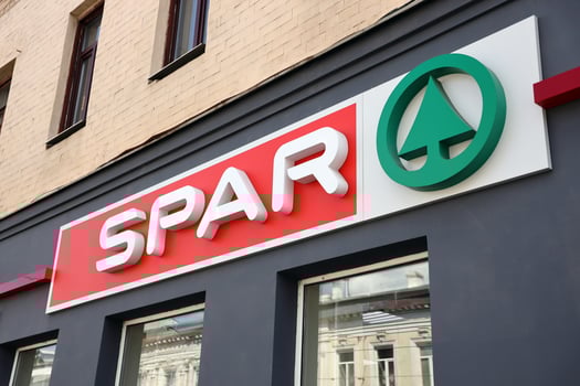 KHARKIV, UKRAINE - AUGUST 29, 2021 Spar logo on a wall. Spar is an international group of independently owned and operated retailers and wholesalers who work together photo