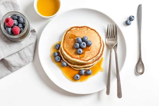 Delicious Pancakes with Fresh Blueberries and Syrup photo