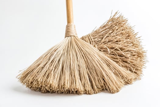 Close-up of a Natural Broom with Wooden Handle photo